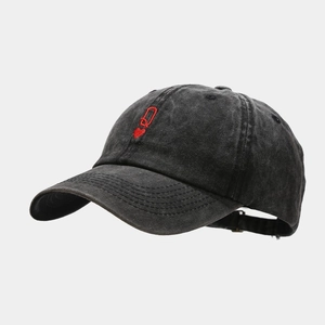 Detail view of washed vintage dark grey baseball cap with red Queen of Hearts embroidery