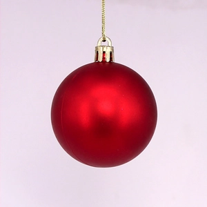 Matte red Christmas ball ornament with golden hanging string for holiday tree decoration