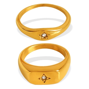 Minimalist 18k gold plated star-set diamond ring set displayed on white background