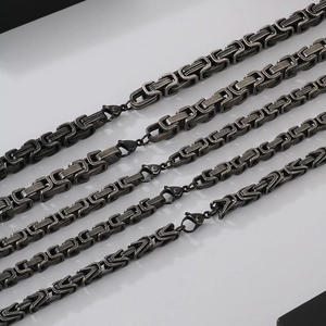 Retro grey Byzantine chain bracelets and necklaces in various thicknesses on white background