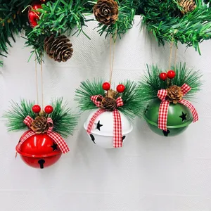 Christmas metal bell ornaments with pine cones and berries in red, white and green