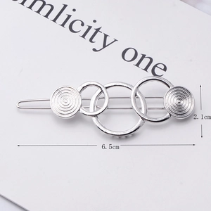 Silver geometric interlaced circle hair clip with spiral texture detail and size dimensions