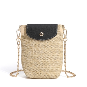 Vertical straw woven crossbody bag with black leather flap and gold chain strap