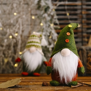 Macro detail of a green knitted gnome hat with buttons and a white faux fur beard