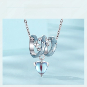 Detail of s925 silver blue starry sky heart charm with glittering zircon star accents