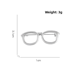 Detailed view of silver glasses brooch showing dimensions 3.1cm x 1cm and 3g weight