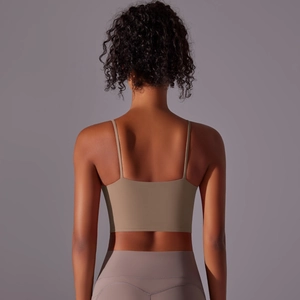 Detail view of khaki yoga tank top with thin straps and a straight open back design