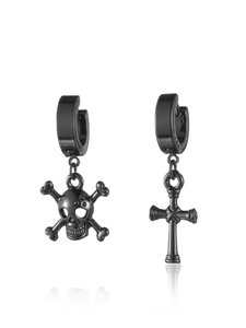 Detail of black stainless steel hoop earrings with asymmetrical skull and cross charms