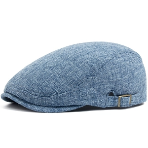 Men's blue cotton linen newsboy hat with breathable texture and side metal buckle