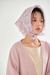 Pink cotton linen floral scarf worn as a breathable decorative headband on model