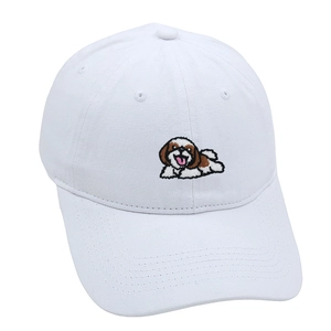 Detailed close-up of colorful puppy embroidery on a vintage white cotton baseball cap