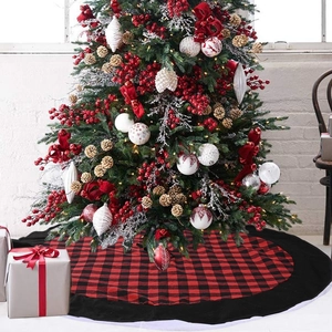 Detail of red and black buffalo plaid Christmas tree skirt with a black border