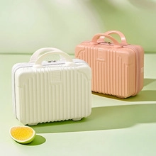 Mini hard-shell makeup cases in white and coral pink with textured vertical stripes