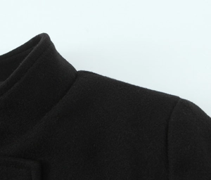 Close-up of the collar and shoulder seams on this black wool blend short coat for women