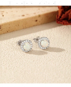 Close-up of S925 silver halo stud earrings with rainbow fire opal and white zircon