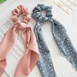 Elegant floral and satin scrunchies with long ribbons in pink and polka dot blue