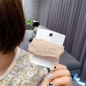 Detail of creative resin hair clip with realistic grilled steak texture and Korea card