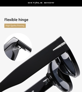 Close-up of flexible hinges and silver metal reinforcement on black sunglasses
