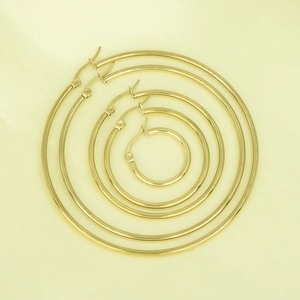 Detailed set of three gold-plated stainless steel hoop earrings in varying sizes
