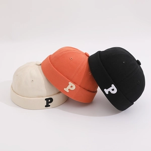 Three Chinese style docker hats in cream, orange and black with P letter embroidery