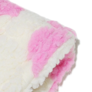 Close-up of the thick pink and white plush lamb wool fabric on a warm winter bucket hat
