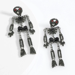 Detailed view of gunmetal skeleton earrings with dark grey and red rhinestones