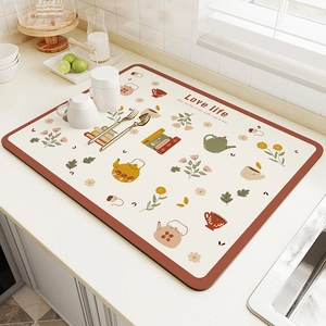 Absorbent kitchen drying mat with floral teapot pattern and red border for countertops