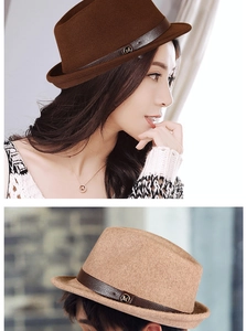 Detail of wool felt jazz hats in brown and beige featuring a leather belt buckle and M logo