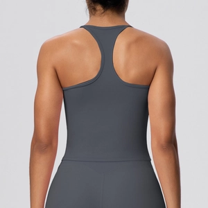 Detail view of the racerback design and high-elastic fabric on a dark grey yoga tank top
