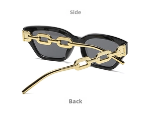 Side view of black sunglasses featuring bold gold chain temples and gray lenses