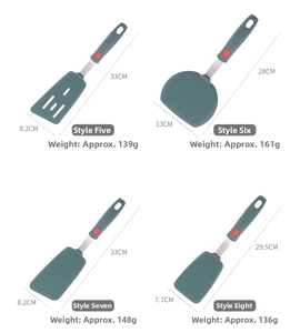 Detailed set of dark green silicone spatulas with stainless steel handles in four sizes