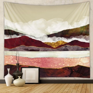 Detailed view of an abstract mountain tapestry with golden textures on a modern grey wall