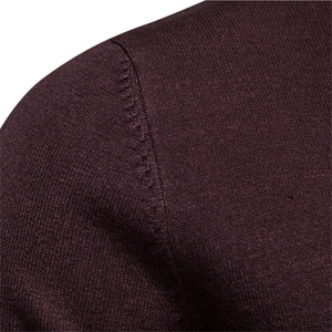 Close-up of shoulder seam detail on a wine red knit sweater for men in winter