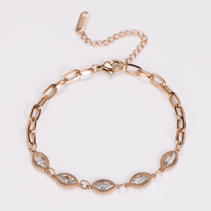 Detail of rose gold bracelet featuring marquise-cut cubic zirconia and lobster clasp