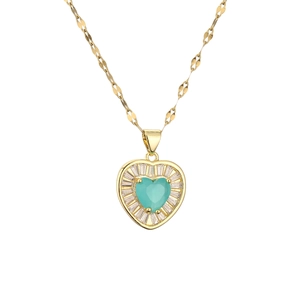 Gold heart necklace with a teal center gem and radiant crystals on a white background