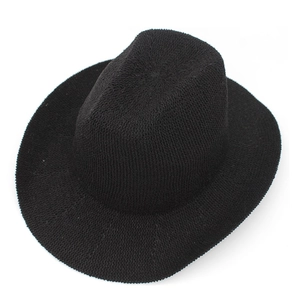 Close-up of the fine woven texture and classic wide brim of this black Panama straw hat