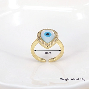 Golden teardrop evil eye ring with blue stone and pavé zircon, open adjustable design