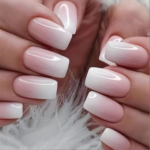 Pink and white ombre gradient square press-on nails with high gloss finish on white feathers
