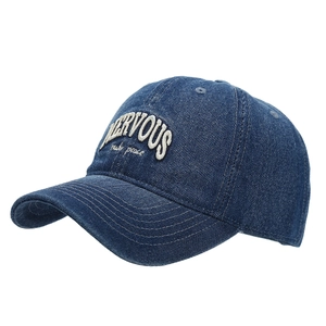 Vintage dark blue denim baseball cap featuring NERVOUS embroidery in a 45-degree side view