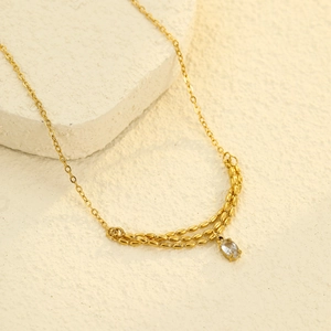 Elegant gold layered stainless steel necklace featuring a sparkling zircon stone pendant