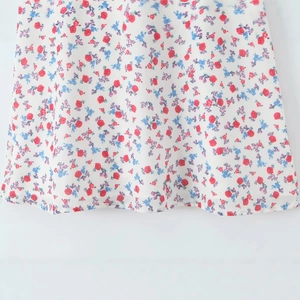 Women's floral summer dress with red and blue flower prints on off-white chiffon fabric