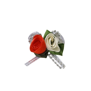 Handmade fabric tulip flowers in red and white with green leaves and ribbon for DIY crafts