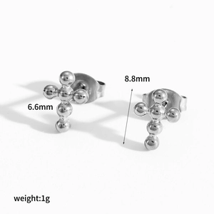 Detailed view of silver cross stud earrings with dimensions 8.8mm by 6.6mm