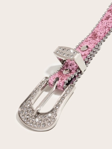 Close-up of pink rhinestone belt with silver glitter texture and studded metal buckle