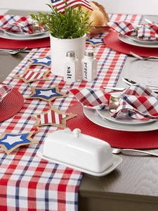 Detail of red round woven placemat featuring Independence Day festive table setting