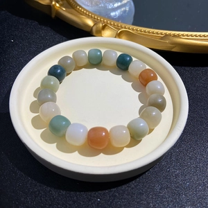 Elegant weathered Bodhi seed bracelet with multi-colored jade-like polished round beads