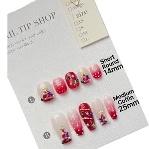 Handmade Christmas press-on nails in short round and medium coffin styles with 3D art