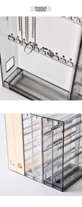 Detailed view of clear acrylic jewelry organizer with sliding drawers and hooks