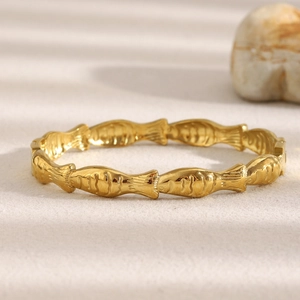 18K gold plated stainless steel fish motif bangle featuring a creative relief design