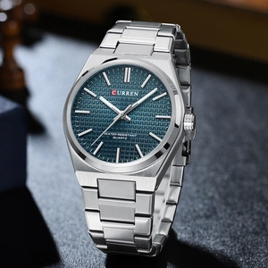 Detailed side view of silver steel business watch featuring deep blue textured dial